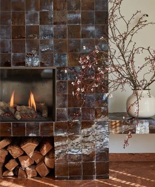 Modern fireplace tiled with brown zellige tiles from Mosaic Factory