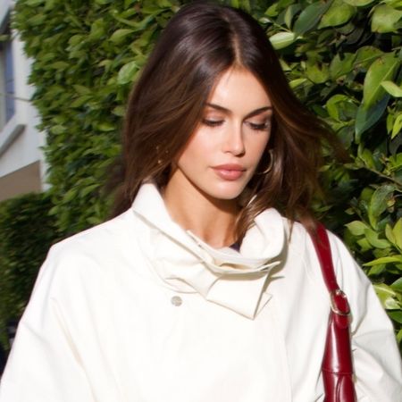 Kaia Gerber wore a $349.99 funnel-neck trench coat with slim sandals, both from Mango