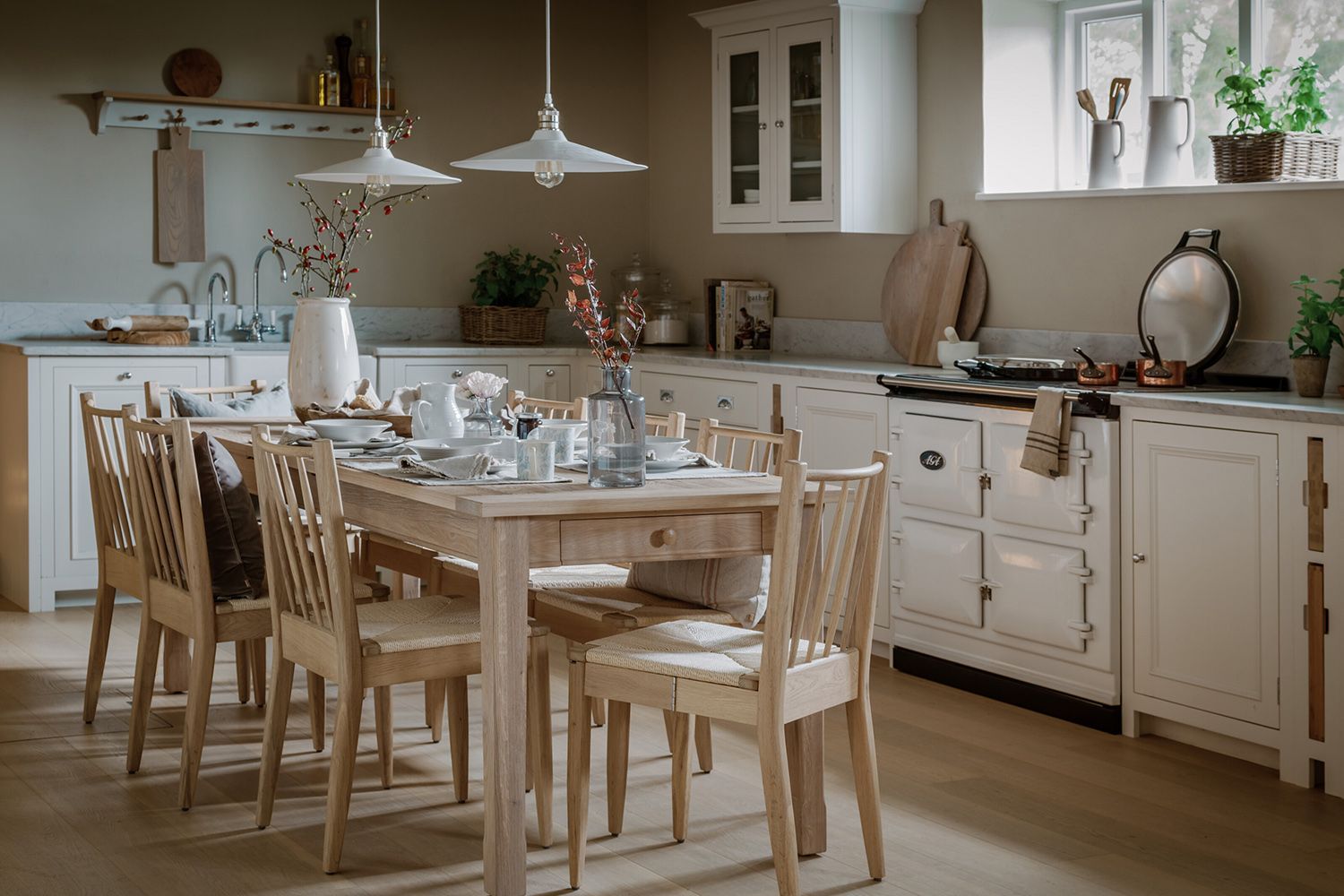 A cream kitchen with a farmhouse table