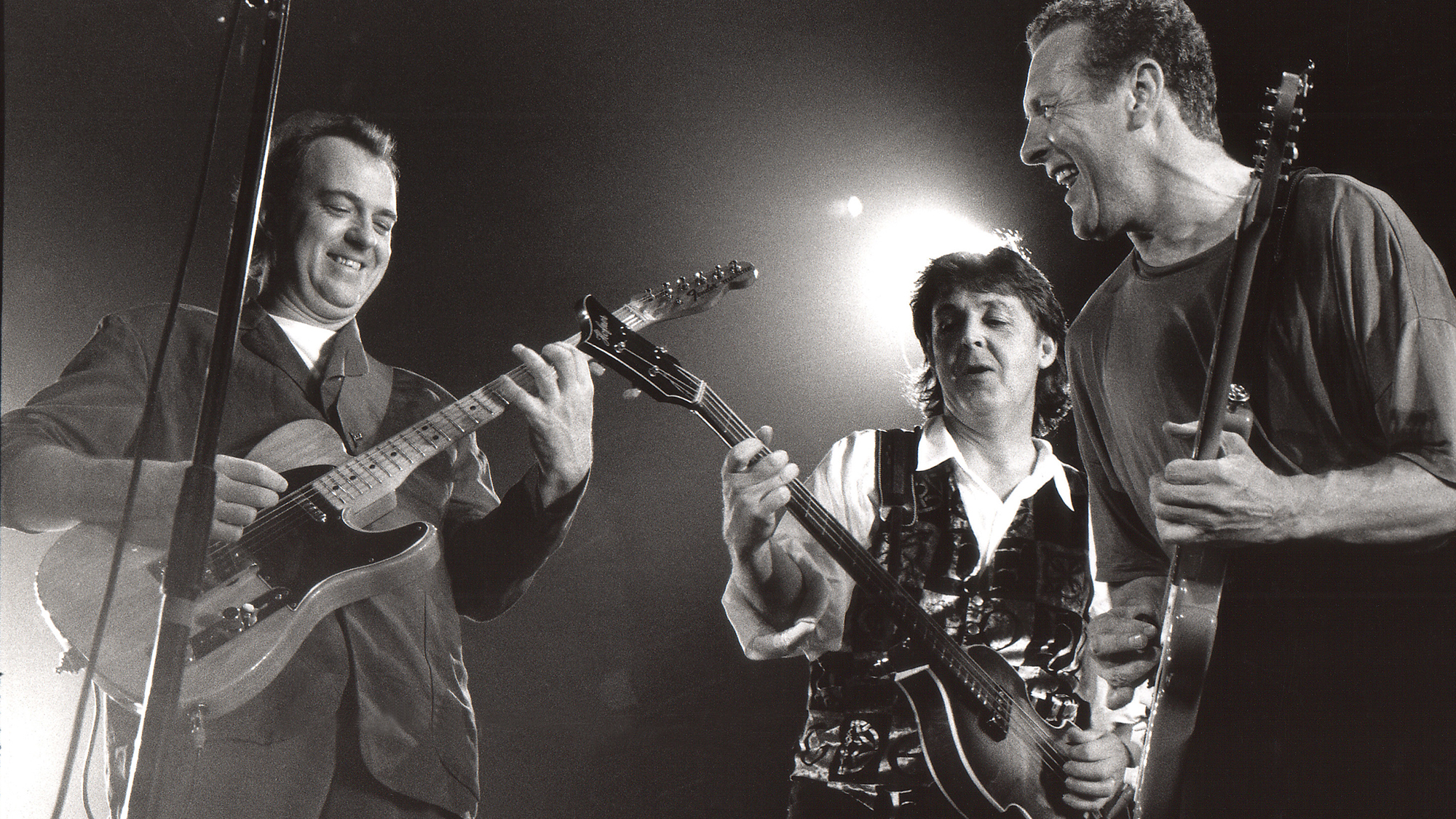 Robbie McIntosh, Paul McCartney, Hamish Stuart perform on stage during a Paul McCartney concert at Ahoy on October 9th 1993 in Rotterdam, Netherlands