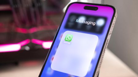 The WhatsApp app tile visible on an iPhone screen