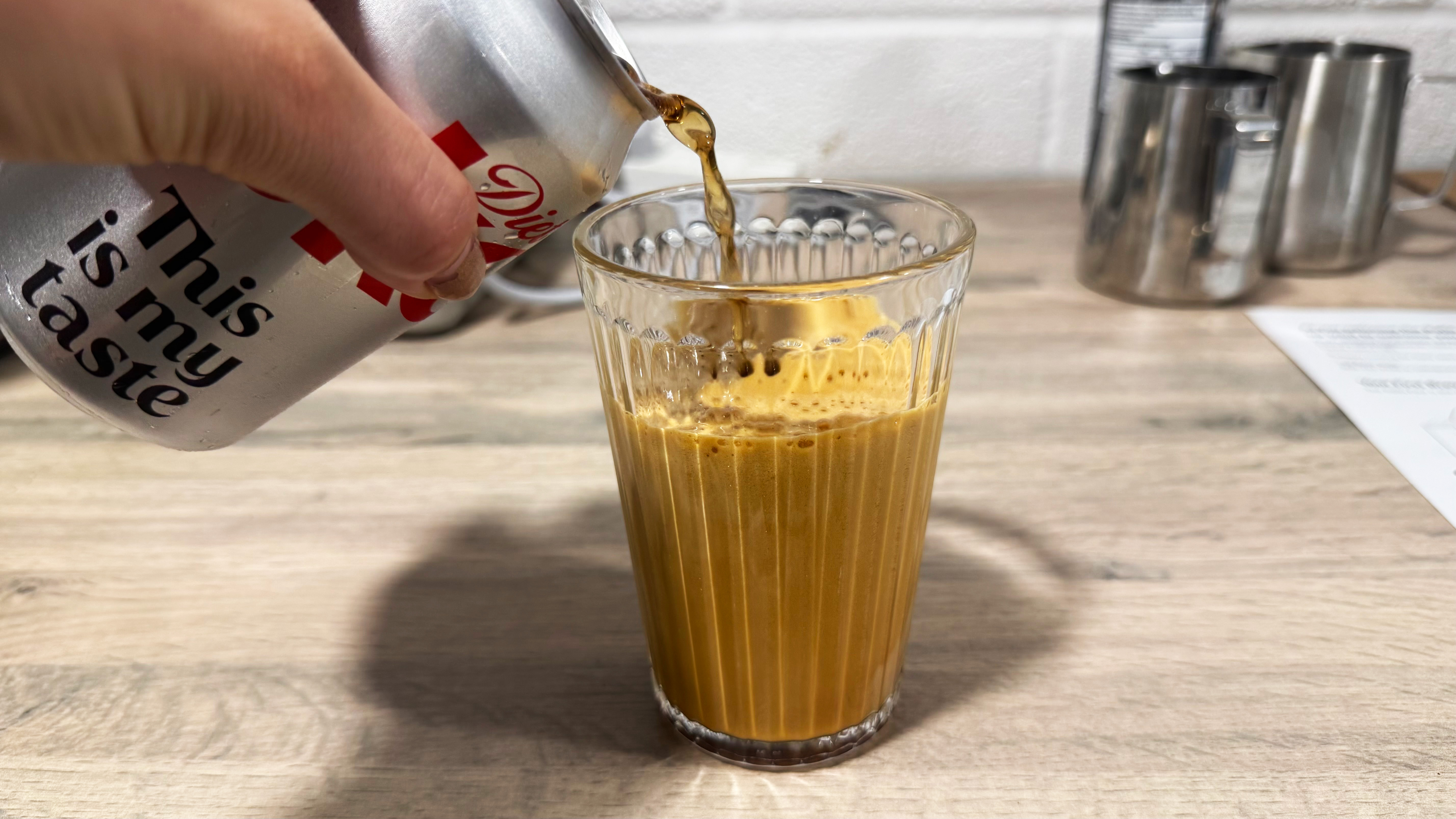 a photo of the viral fridge cigarette coffee + diet coke being made