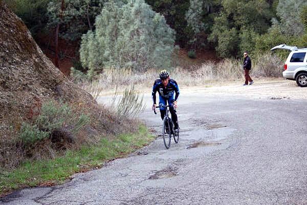 Lance gets a head start, arriving at the bottom of the climb a minute ahead of the group.