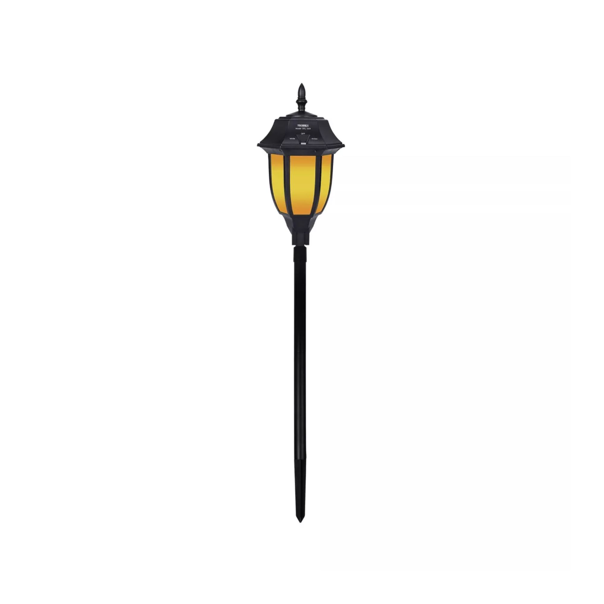 A black outdoor wireless light with an amber light and a base with a spike at the bottom