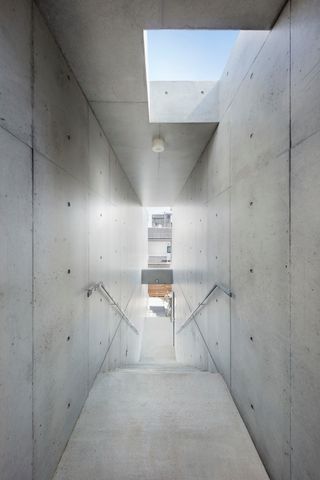 interior of circulation space in Music Hall & Residential units by Ryuichi Sasaki Architecture