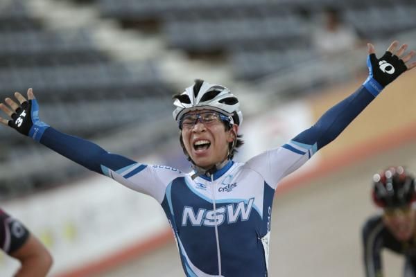 Luke Dubridge celebrates his win in the men's 40km points race after a nail-biting finish.