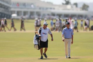 Harris English walks with his caddie at the US Open
