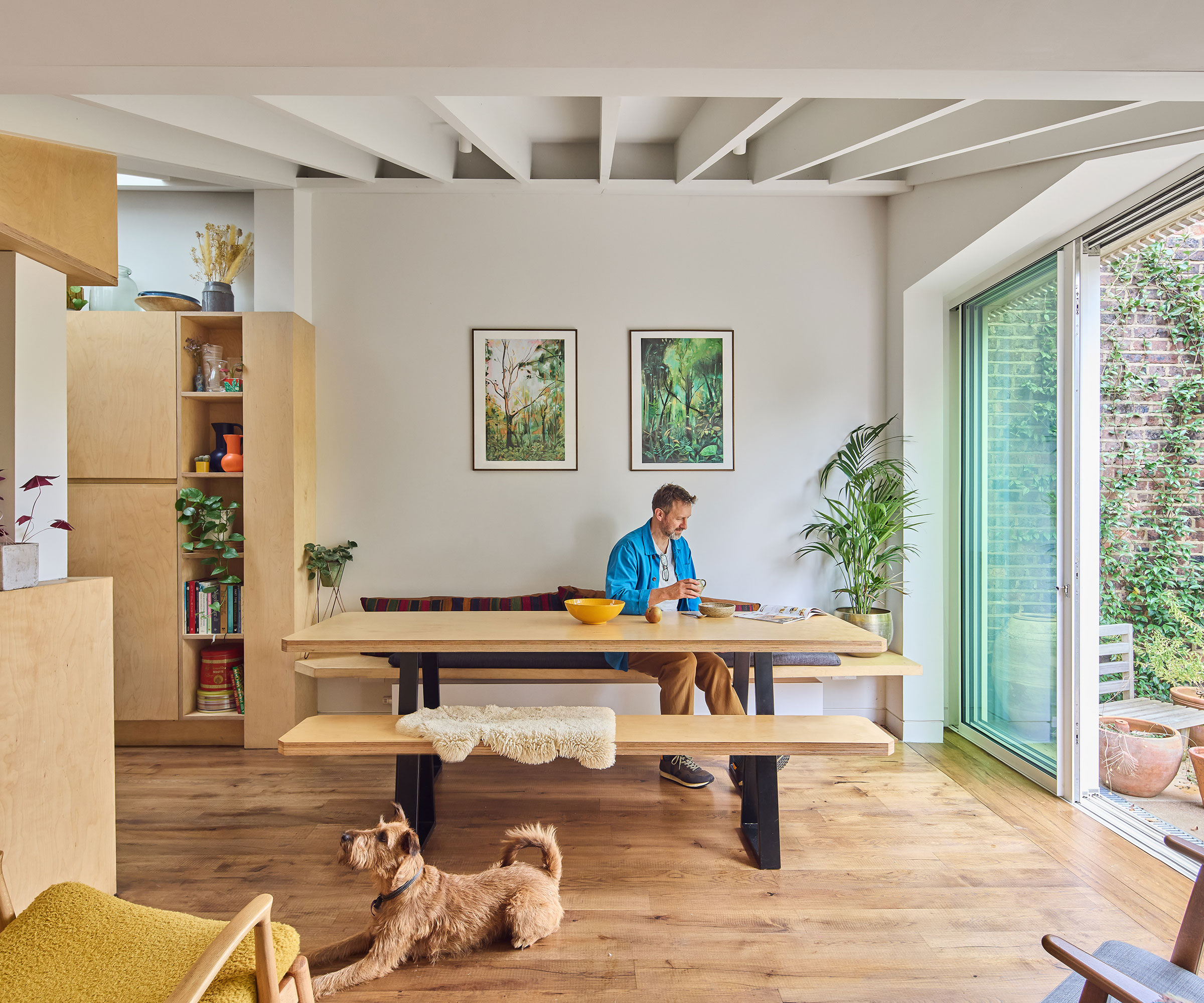 renovated house with an extended dining space and sliding doors leading out to a garden