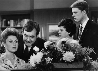 Photo of the Cunningham family from the television program Happy Days. Pictured are Marion Ross (Mrs. Cunningham), Tom Bosley (Mr. Cunningham), Erin Moran (Joanie Cunningham) and Ron Howard (Richie Cunningham).