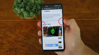 How to take a screenshot on an Android phone - OnePlus 9 Pro shown pressing multifunction button and volume down