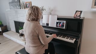 Woman plays her digital piano