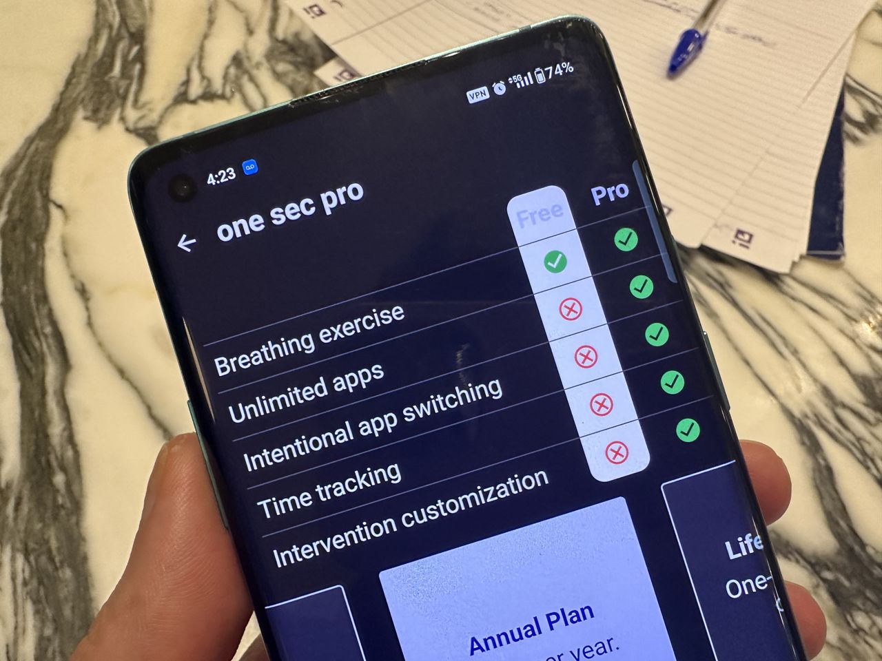 One Sec app, open on Android smartphone against marble table.