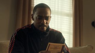 John Doe looking at Baby-Sitter's Club book