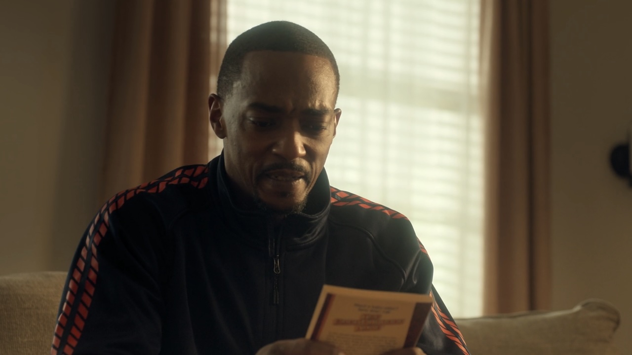 John Doe looking at Baby-Sitter&#039;s Club book