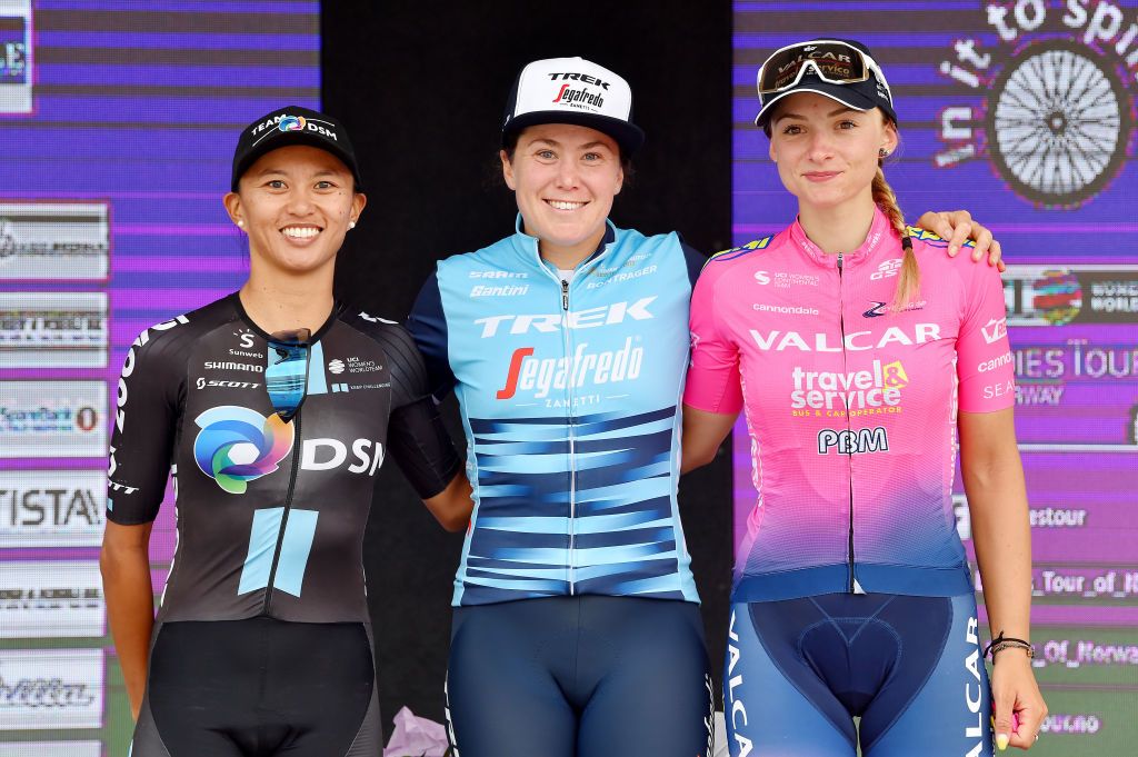 HALDEN NORWAY AUGUST 15 LR Coryn Rivera of United States and Team DSM Women second place stage winner Chloe Hosking of Australia and Team Trek Segafredo and Chiara Consonni of Italy and Team Valcar Travel Service on third place pose on the podium during the podium ceremony after the 7th Ladies Tour Of Norway 2021 Stage 4 a 1416km stage from Drbak to Halden LTourOfNorway LTON21 UCIWWT on August 15 2021 in Halden Norway Photo by Luc ClaessenGetty Images