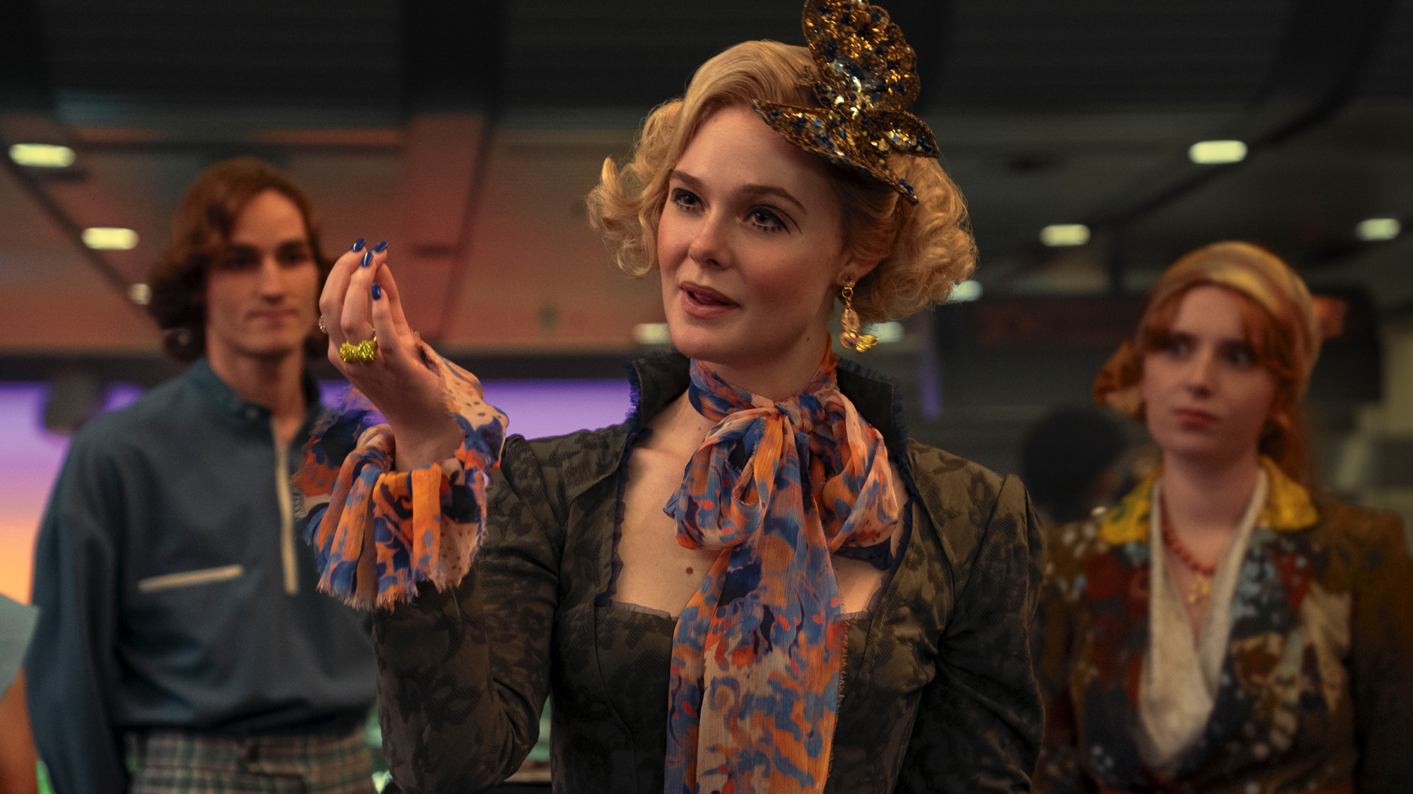Elle Fanning in an over-the-top costume in Sunrise on the Reaping