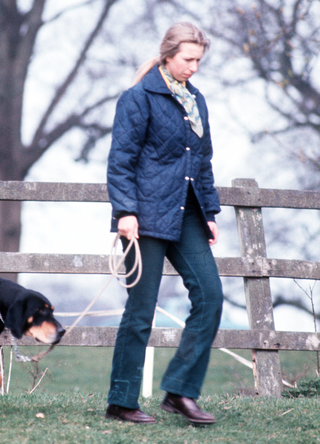 Princess Anne, Princess Royal takes a stroll with her dog in the grounds of Gatcombe Park on March 01, 1974 in Gatcombe England