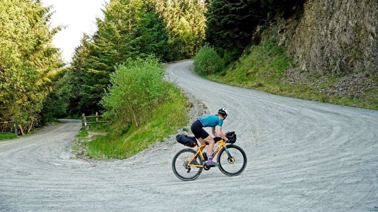 Anna Marie Abram riding on a gravel trail