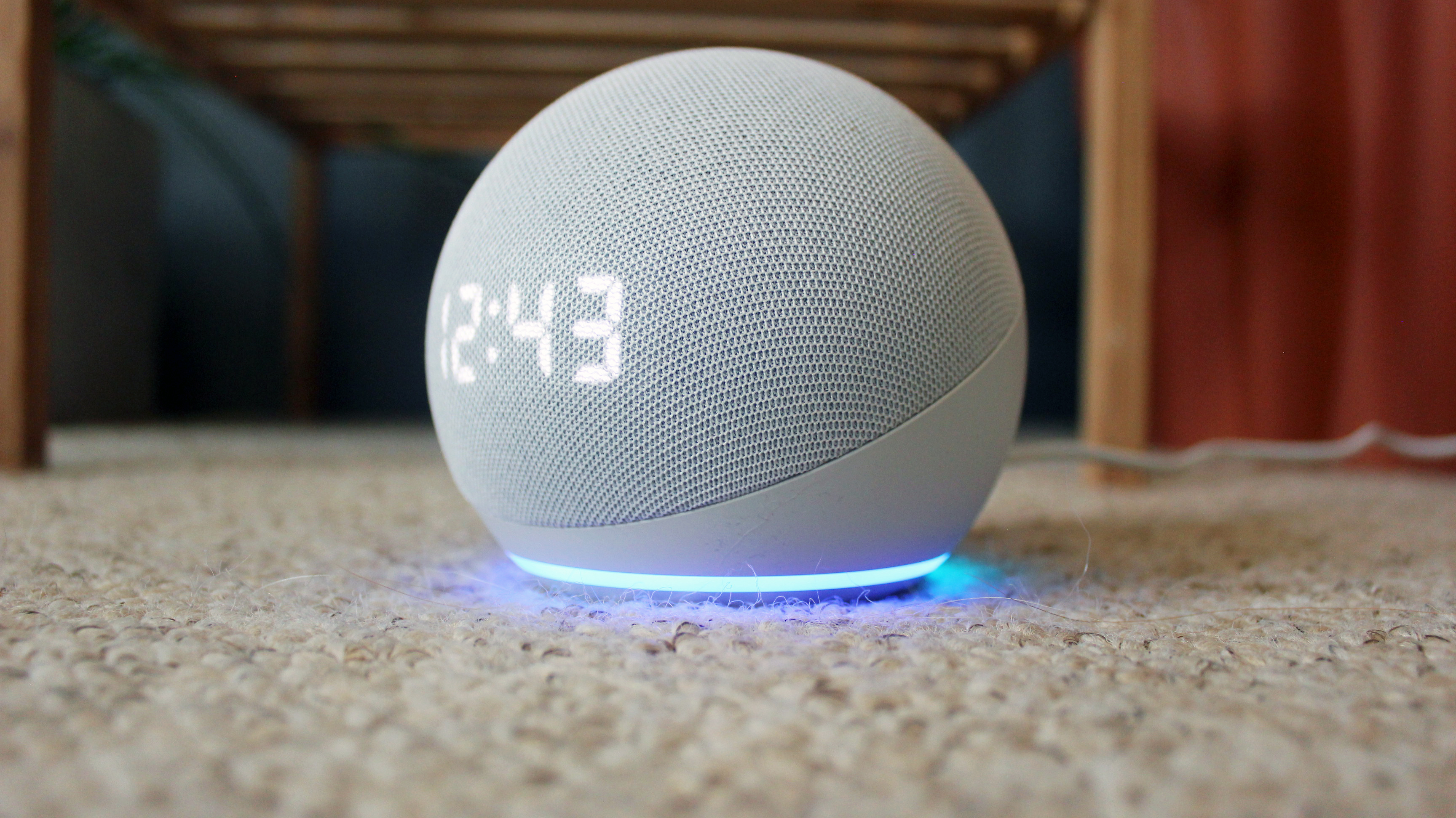 amazon echo dot with clock 2020 on a carpet