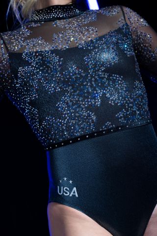 a close up of a Team USA olympics gymnastics uniform with blue crystals