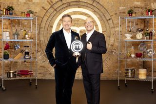 MasterChef judges John Torode and Gregg Wallace holding the trophy