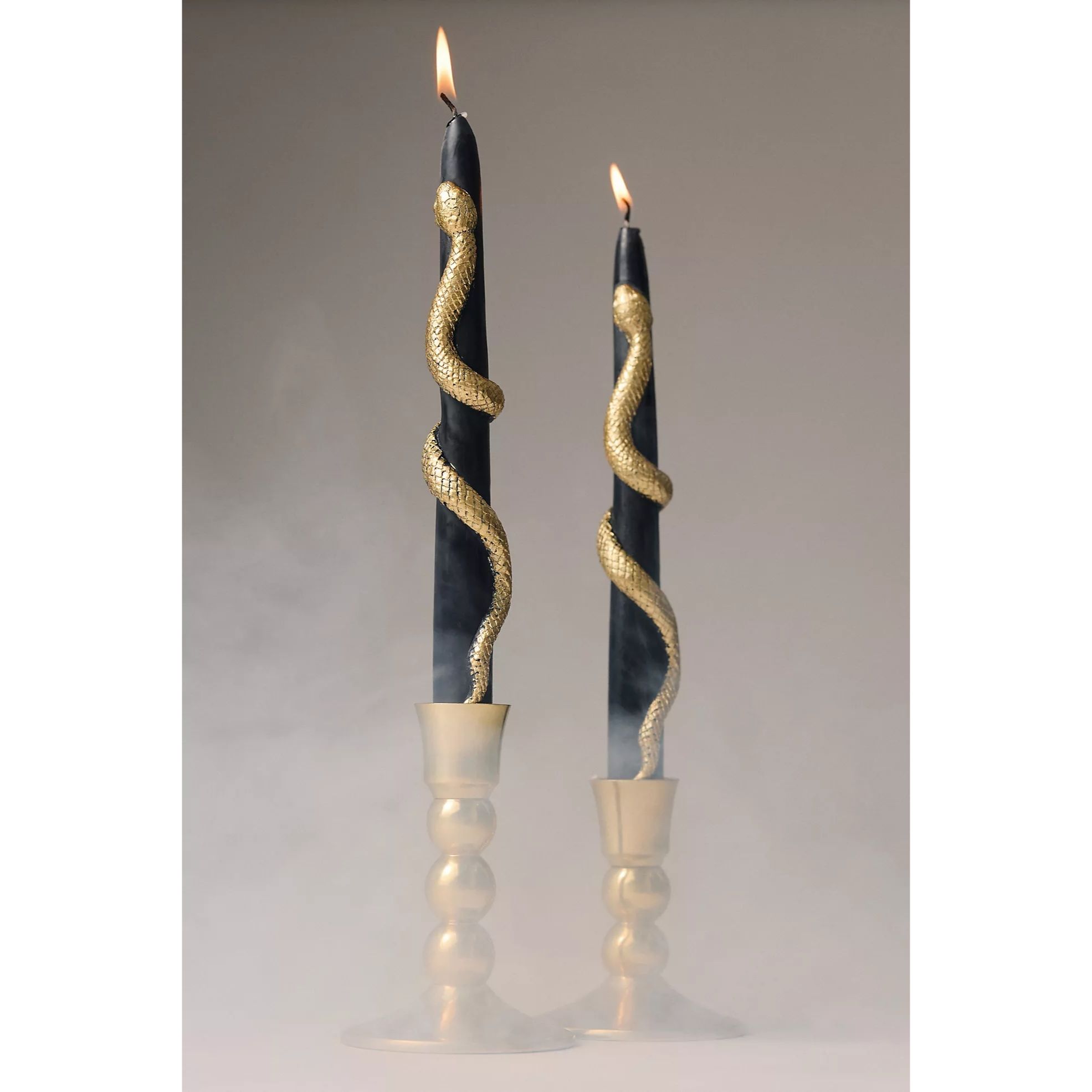 black candles with gold snakey accents