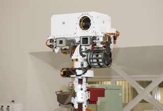 The remote sensing mast on NASA Mars rover Curiosity holds two science instruments for studying the rover surroundings and two stereo navigation cameras for use in driving the rover and planning rover activities. 
