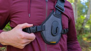 Cotton Carrier Skout G2 worn by a man in a burgandy jacket outdoors in a woods