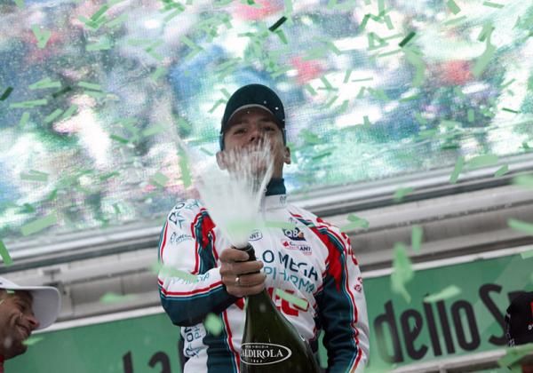 Tour of Lombardy winner Philippe Gilbert uncorks the bubbly in Como.