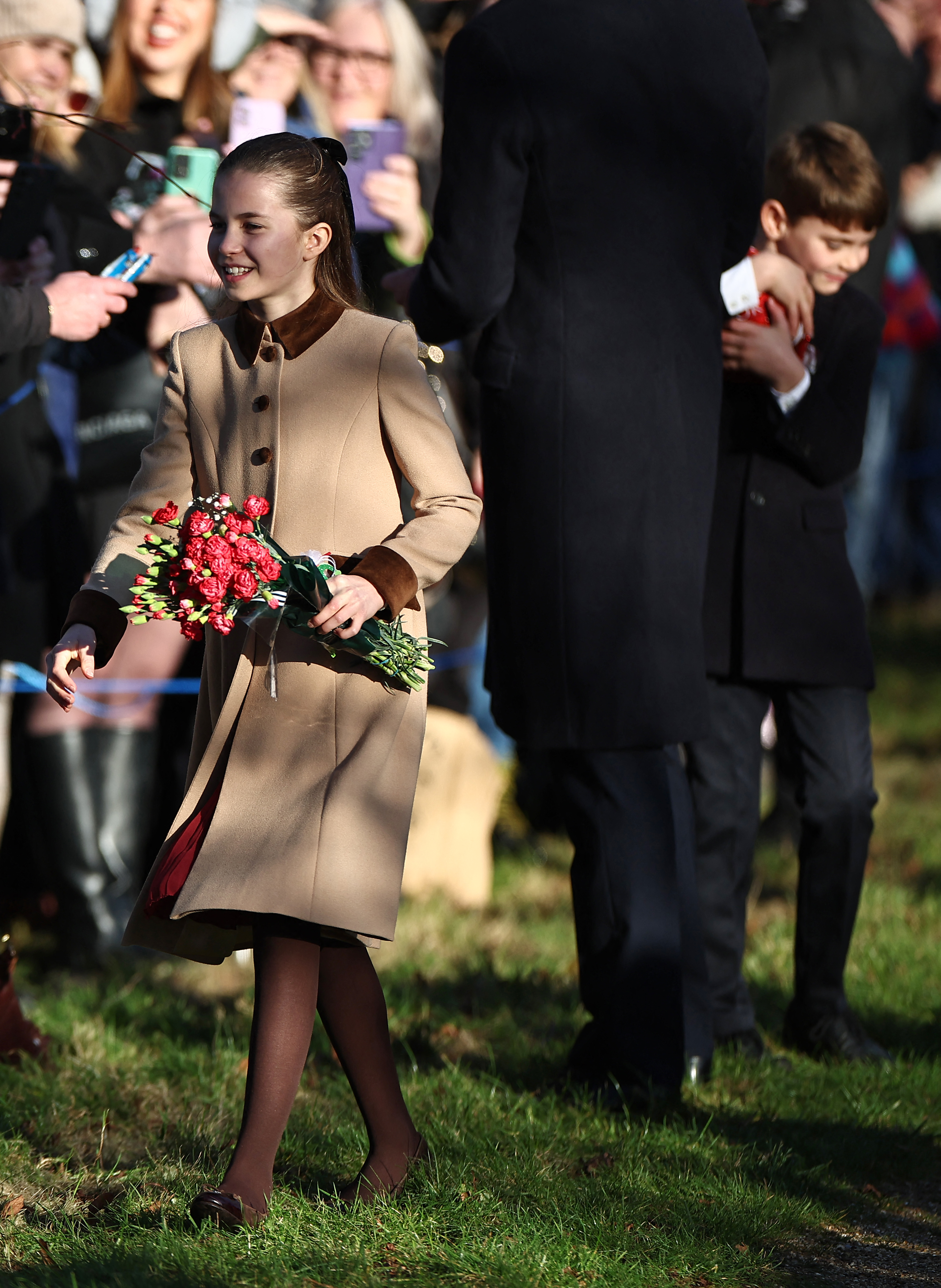 Prince Louis grabs a giant chocolate gift from a fan and his dad runs damage control