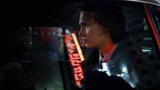 Ansel Elgort riding in a taxi in Tokyo at night in Tokyo Vice