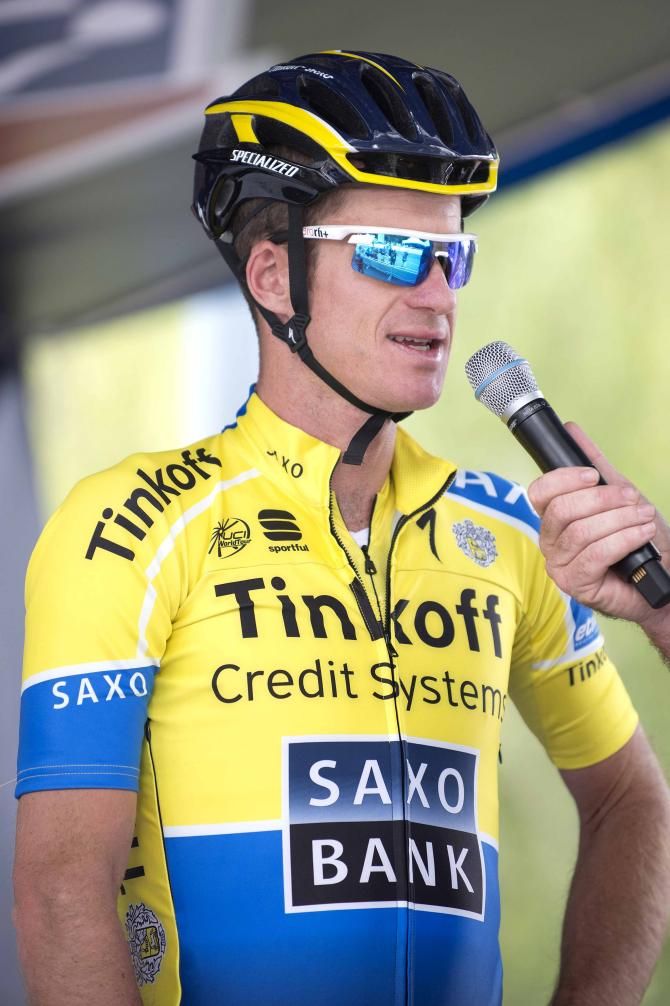 Michael Rogers talks on stage ahead of the stage