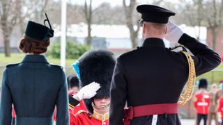 Catherine, Duchess of Cambridge and Prince William, Duke of Cambridge takes the salute as they attend the 1st Battalion Irish Guards