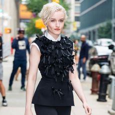 Julia Garner wears black leggings