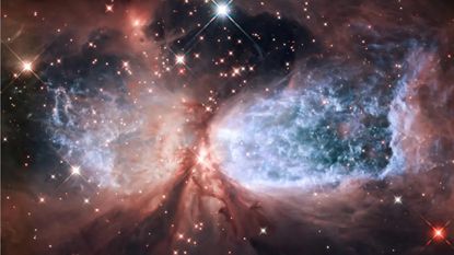 The bipolar star-forming region, called Sharpless 2-106, looks like a soaring, celestial snow angel.