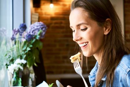 Woman eating pancakes