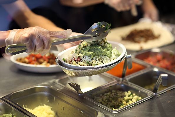 Preparing a Chipotle burrito bowl.