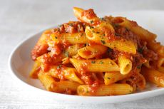 Close up image of budget bolognese on penne pasta