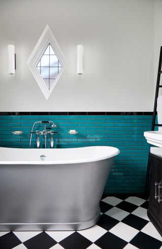 Bathroom with teal subway tiles