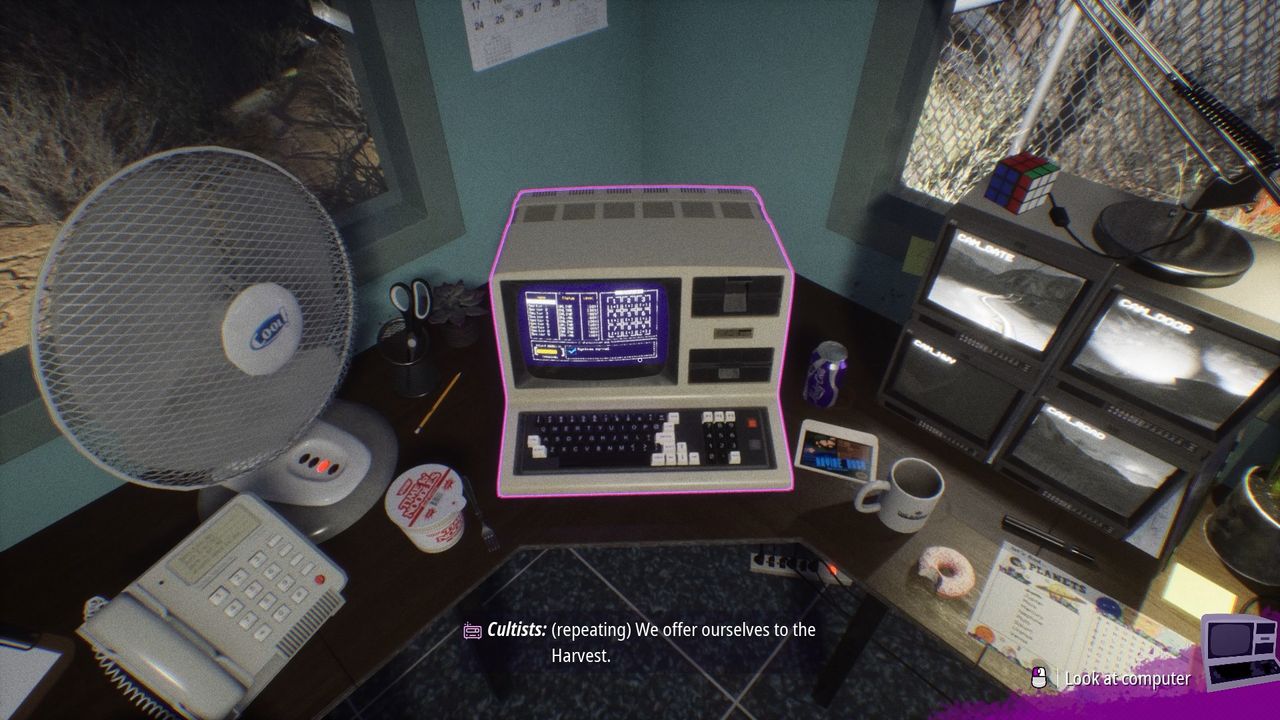 Close up looking down at the computer on the desk in Interference's office