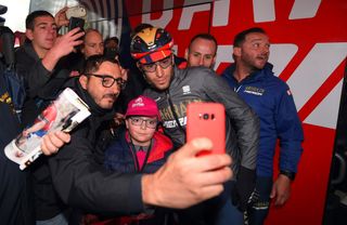 Vincenzo Nibali poses for a photo with some fans