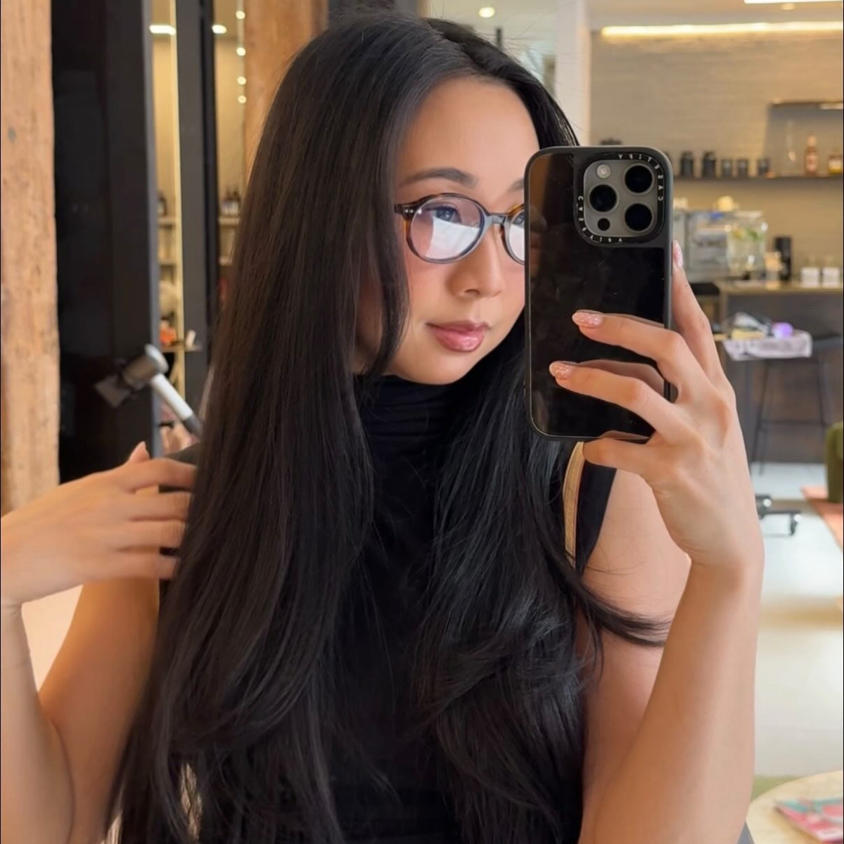 A woman with long layered hair