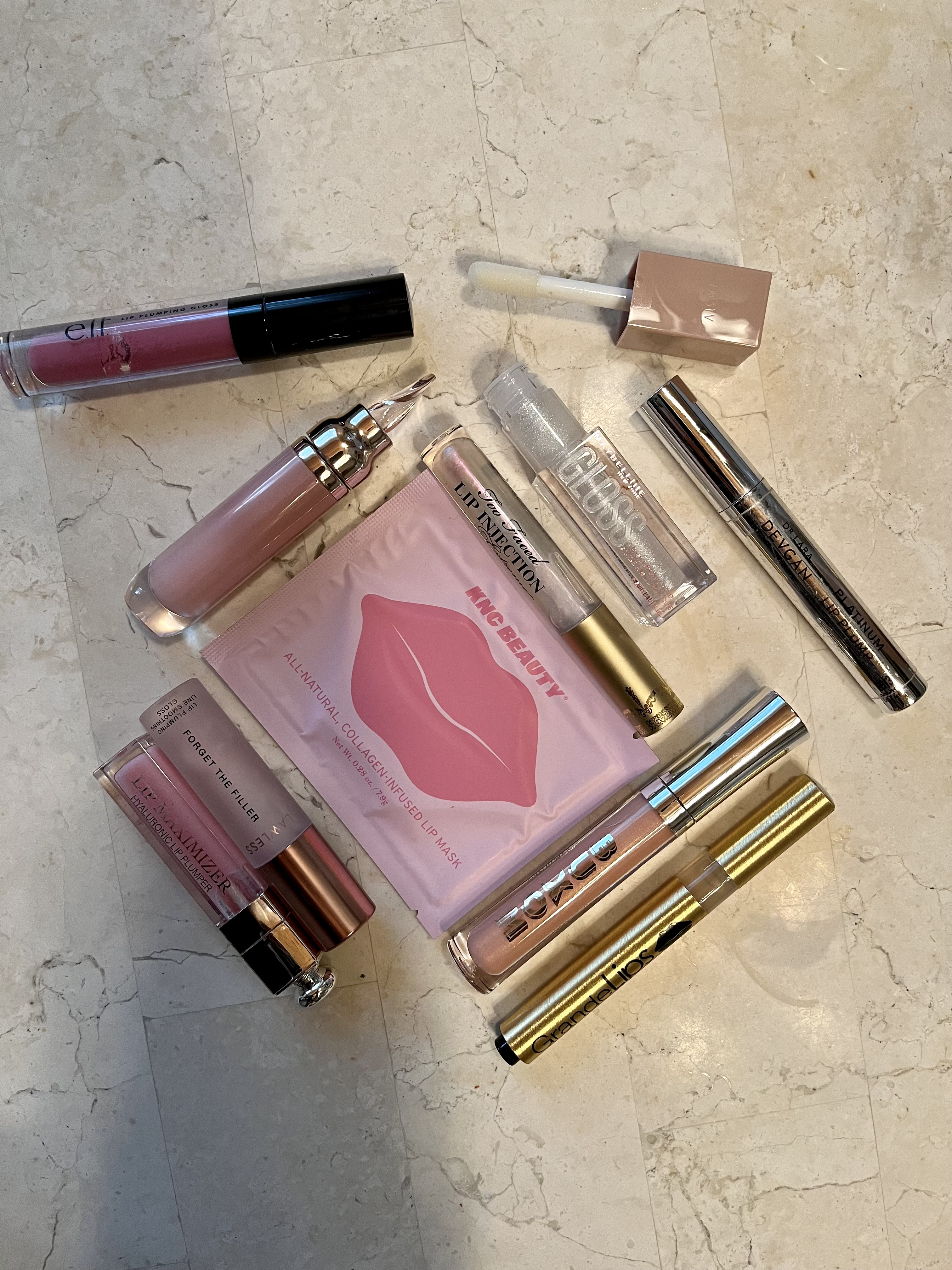 Flatlay of the best lip plumpers on a counter