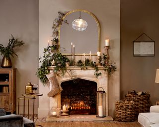 Naturally styled Christmas fireplace with trailing foraged greenery