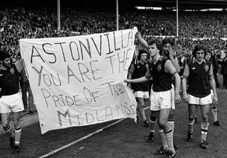 Aston Villa players unfurl a celebratory banner after finally winning the 1977 League Cup