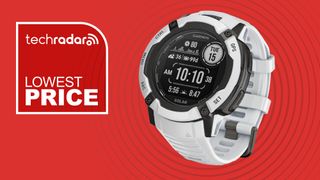 Garmin Instinct 2X Solar watch on red background with white text reading "TechRadar lowest price"