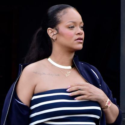 Rihanna brought back the tube top with a khaki Miu Miu skirt and Puma sneakers.