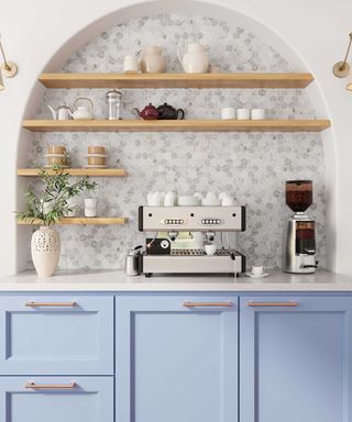 blue kitchen with archway and coffee machine