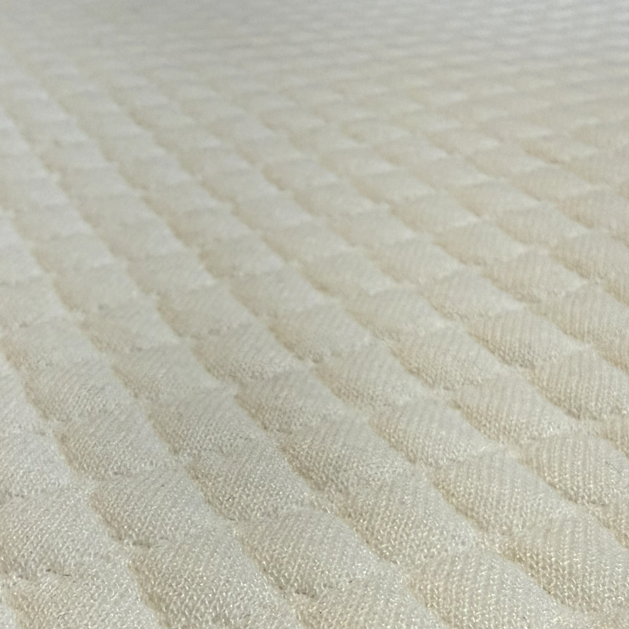 The cover of the Simba Hybrid Essential Mattress Topper