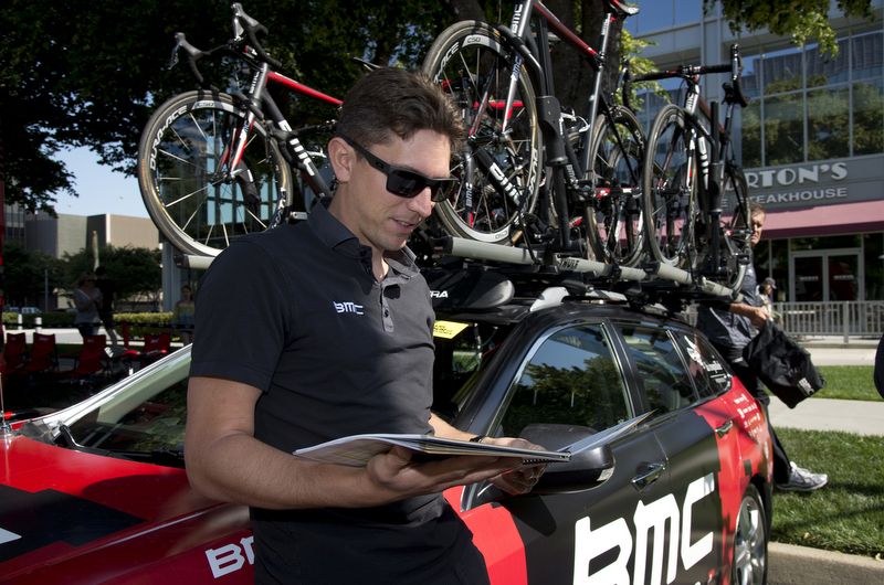 BMC sport director Yvon Ledanois checks the race book